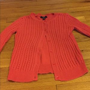 A soft, red cardigan.